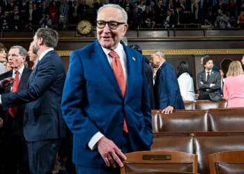 Senate Minority Leader Chuck Schumer, a New York Democrat, chats with colleagues before President Donald Trump's State of the Union address Tuesday at the Capitol in Washington, D.C.