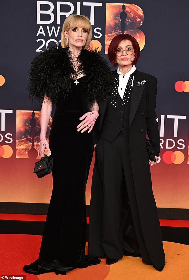 She was joined at the awards show by daughter Kelly, 41, with both wearing sweet tributes to the late rocker on their black outfits