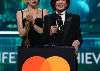 Sharon and Kelly Osbourne make heartfelt speech in honour of Ozzy while Dolly Parton and Robbie Williams pay 'fitting tribute' to the late rocker as he's awarded Lifetime Achievement Award at the BRITs