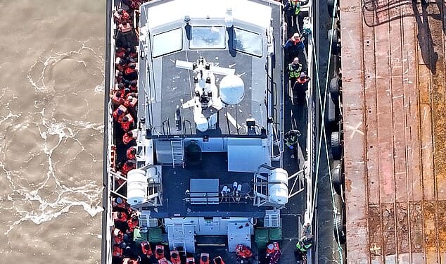 Channel boat migrants (pictured on Wednesday) are being waved on to British soil without strict security checks when they disembark, a Daily Mail investigation can reveal