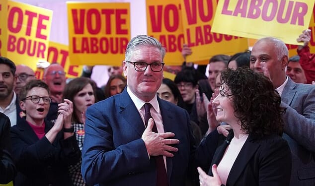 Keir Starmer visited Gorton & Denton on Monday but was carefully surrounded by Labour activists, candidate Angeliki Stogia (right) and his deputy Lucy Powell inside a sports centre