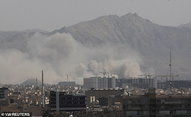 Smoke rises following an explosion, after Israel and the US launched strikes on Iran, in Tehran