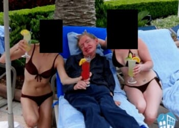 The bikini-clad women who posed with Professor Stephen Hawking in this photograph included in the Epstein files were his full-time carers