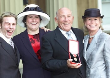 Sir Stirling Moss and his wife Susie, accompanied by Elliot and Allison, as he collected his knighthood at Buckingham Palace