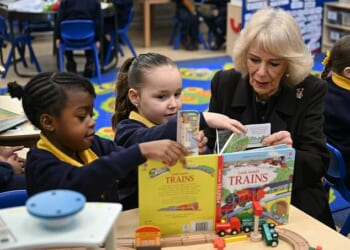 Queen Camilla meets with pupils as she attends the opening of a library at Christ Church Primary School in London