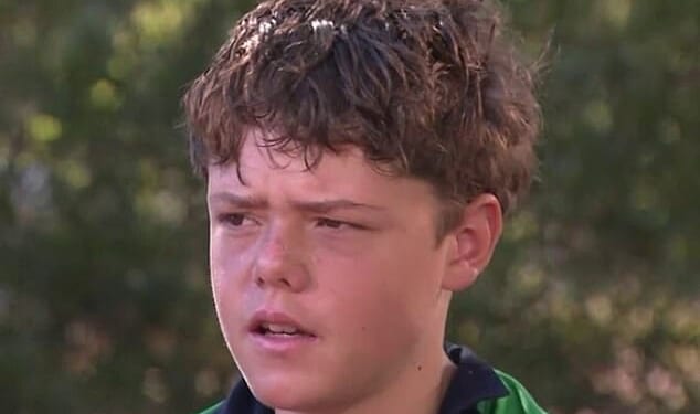 A 13-year-old boy (pictured) who swam for four kilometres in dangerous swells to save his stranded family has been hailed a hero