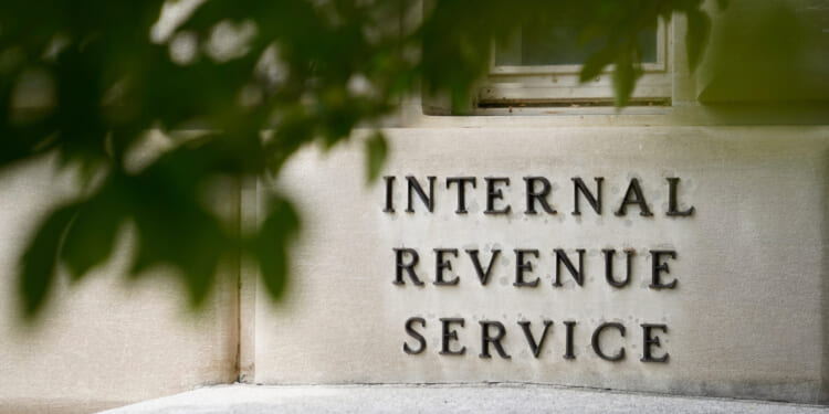 A sign is displayed outside the Internal Revenue Service building May 4, 2021, in Washington, D.C.
