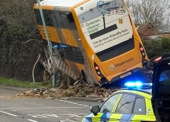 Two people have been rushed to hospital after a double-decker bus was involved in a crash with a car