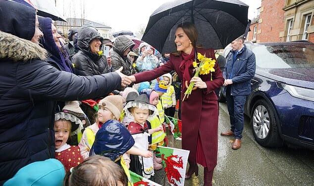 The Prince and Princess of Wales pictured meeting members of the public during a visit to the Hanging Gardens in Llanidloes, Wales on Thursday, ahead of St David's Day