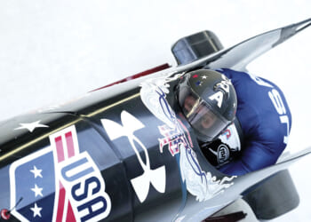 Winter Olympian bobsledders and skiers model peace, unity