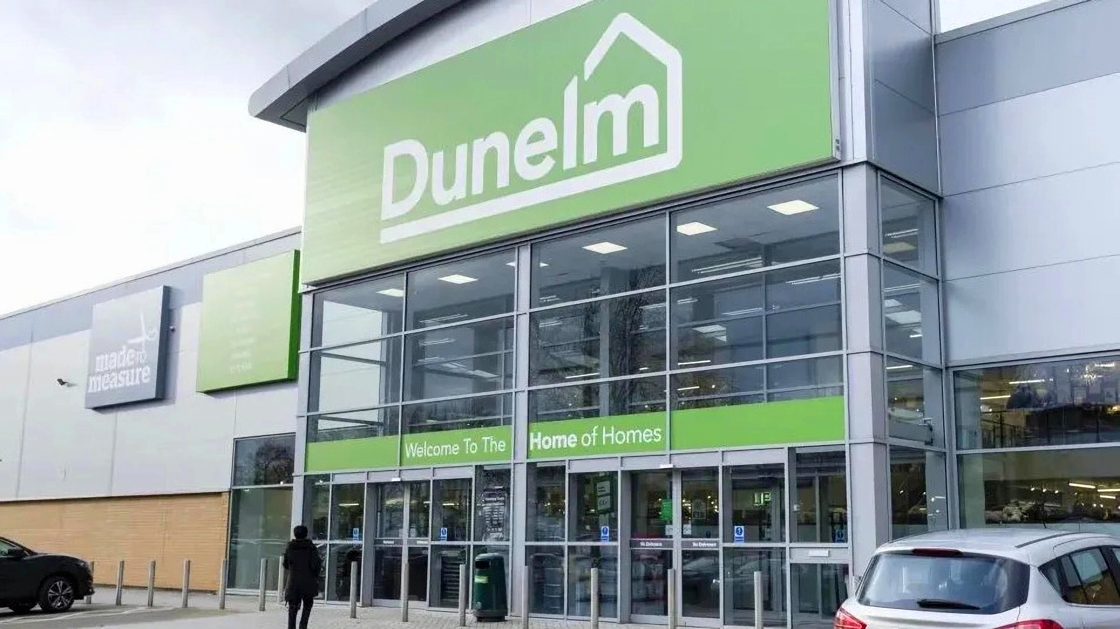 Exterior view of a Dunelm store entrance with a green sign.