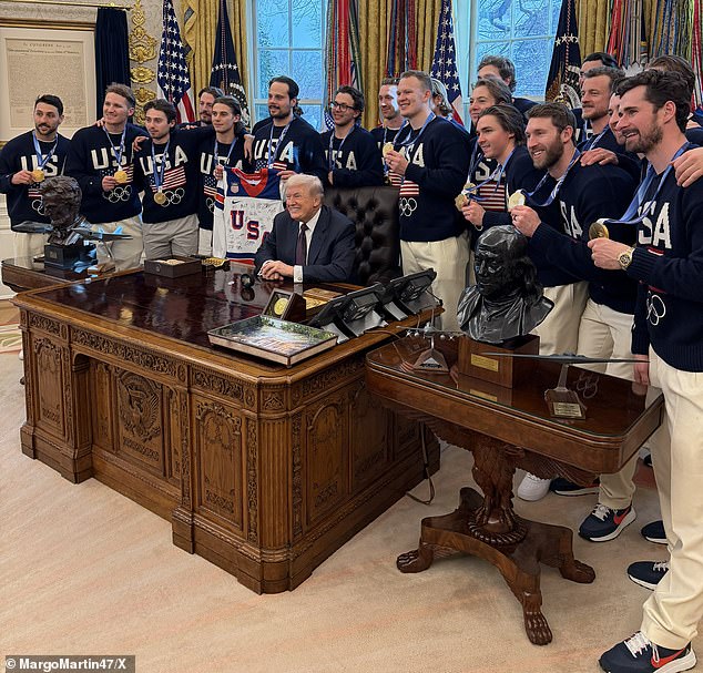 The men's team pictured alongside President Trump at the Oval Office earlier this week