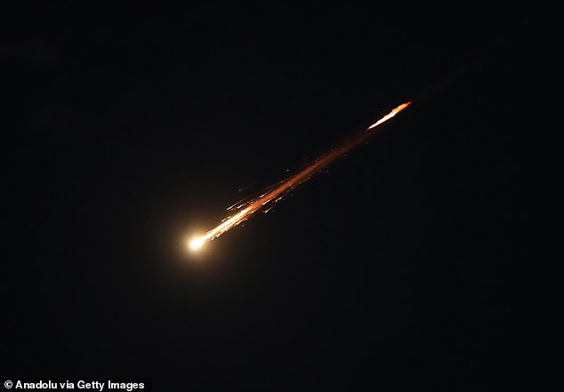 Some of the missiles launched from Iran are spotted in the skies over Hebron, south of Jerusalem, last night