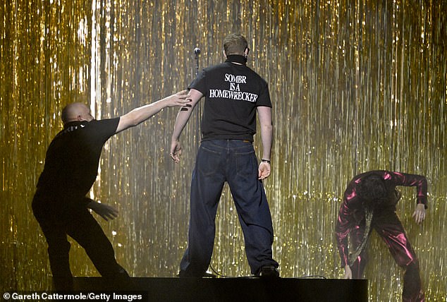 After pushing Sombr, the unidentified man then turned around to reveal a t-shirt that read 'Sombr is a homewrecker' which turned out to be a PR stunt to promote his latest single