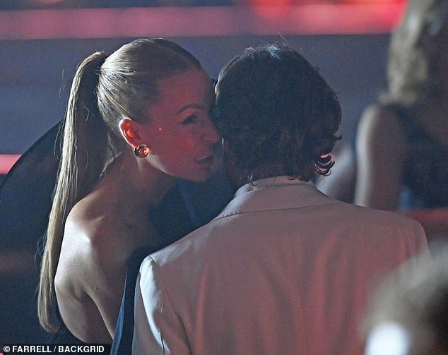 Since she has thrown herself into work and at the Brits held in Manchester was seen catching up with pal Pete who she hosts her Kiss FM radio show with