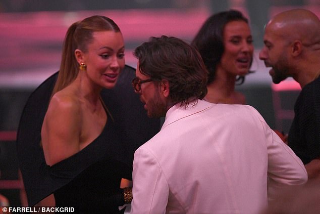 She was seen leaning in to him amid the busy and noisy surroundings while Pete, 37, spoke animatedly back to her