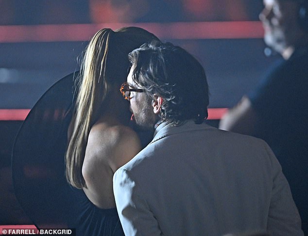 Olivia raised eyebrows with pal Pete as they were pictured cosying up during a messy trip to Ibiza last August