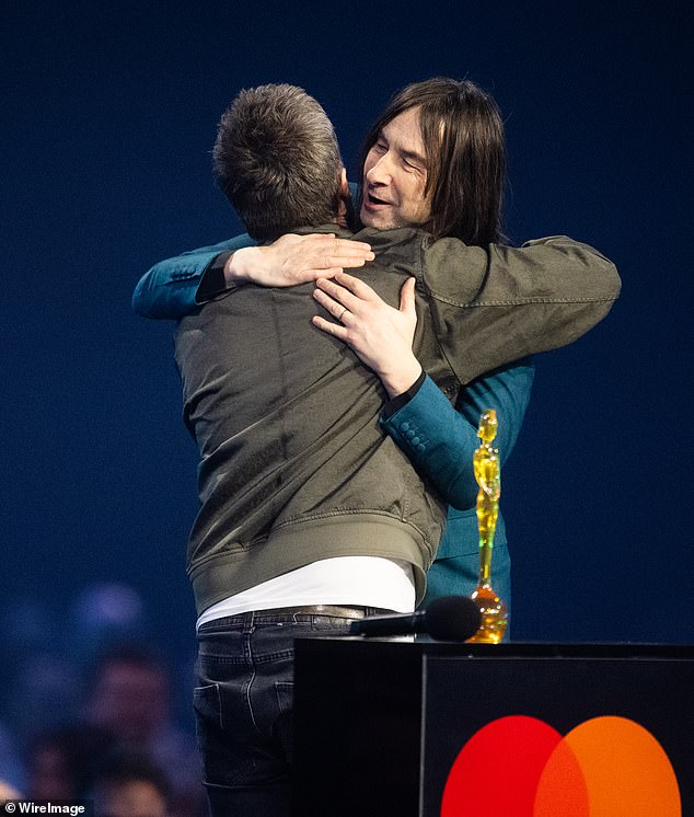 When presented with the award from Bobby Gillespie, lead singer of Primal Scream, Noel first thanked his brother Liam