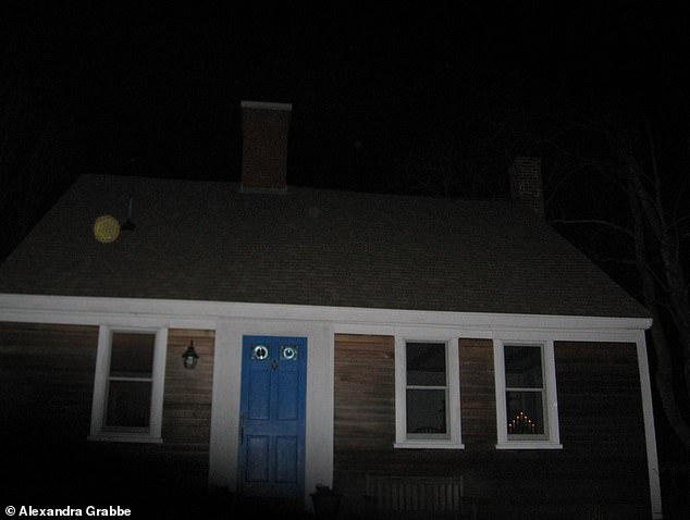 A mysterious orb appears in the photograph Grabbe took of the Cape Cod home after her mother passed: 'It looks exactly like images I have seen in books written by ghost-hunters'