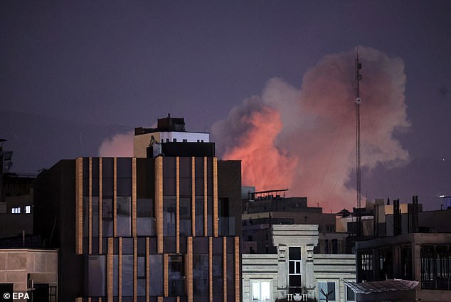 Smoke rises over Tehran after the second consecutive day of strikes by the US and Israel on Iranian targets