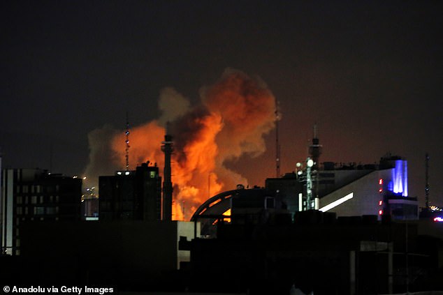 Smoke rises after explosions rocked multiple areas of Tehran on Sunday during the second day of US and Israeli strikes against the Islamic regime, which took out 48 leaders, President Donald Trump told the Daily Mail on Sunday