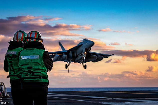This image provided by U.S. Central Command shows a F/A-18E Super Hornet preparing for an arrested landing on the USS Gerald R. Ford (CVN 78) after a mission in support of Operation Epic Fury, on Saturday