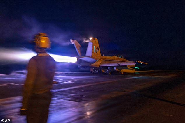 This image provided by U.S. Central Command shows a F/A-18E Super Hornet aircraft launching from the USS Abraham Lincoln (CVN 72) in support of Operation Epic Fury, on Sunday