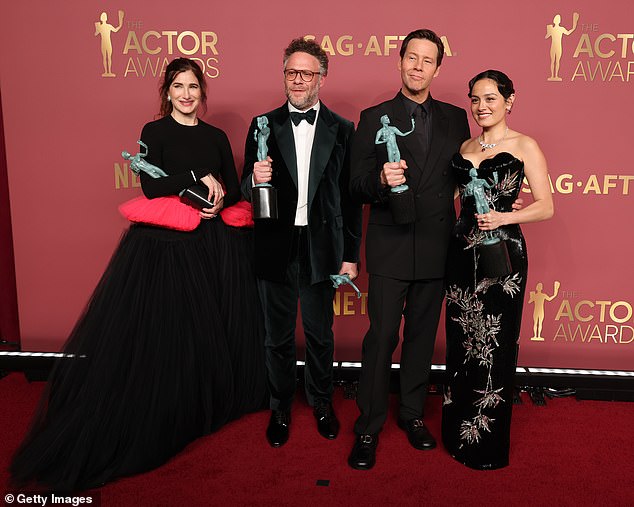 Kathryn Hahn, Rogen, Ike Barinholtz and Chase Sui Wonders are seen left to right with their shiny new trophies