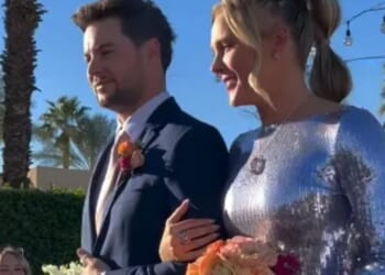 Jojo Siwa looks stunning as she walks down the aisle with boyfriend Chris Hughes in shimmering gown at family wedding