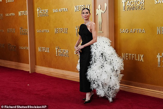 Moore made her grand entrance in her opulent gown and Mary Jane style heels