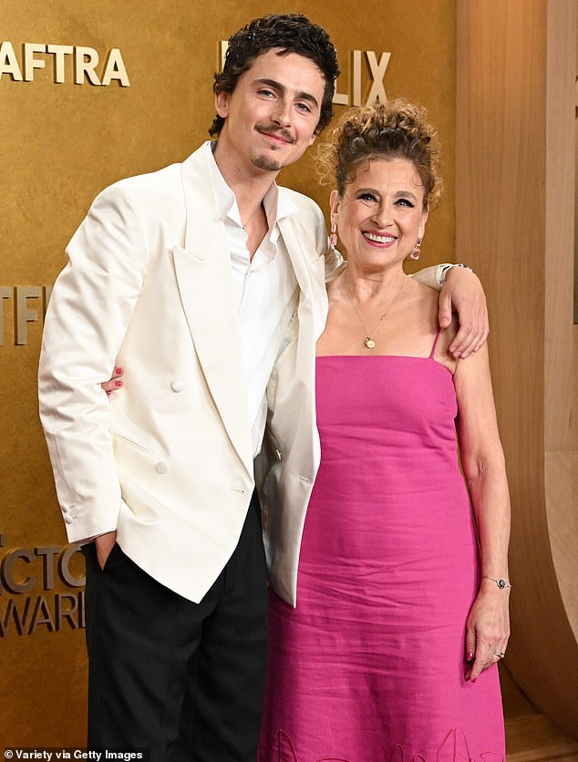 The star flashed a cheerful smile next to his mother Nicole Flender at the glitzy event which took place at the Shrine Auditorium