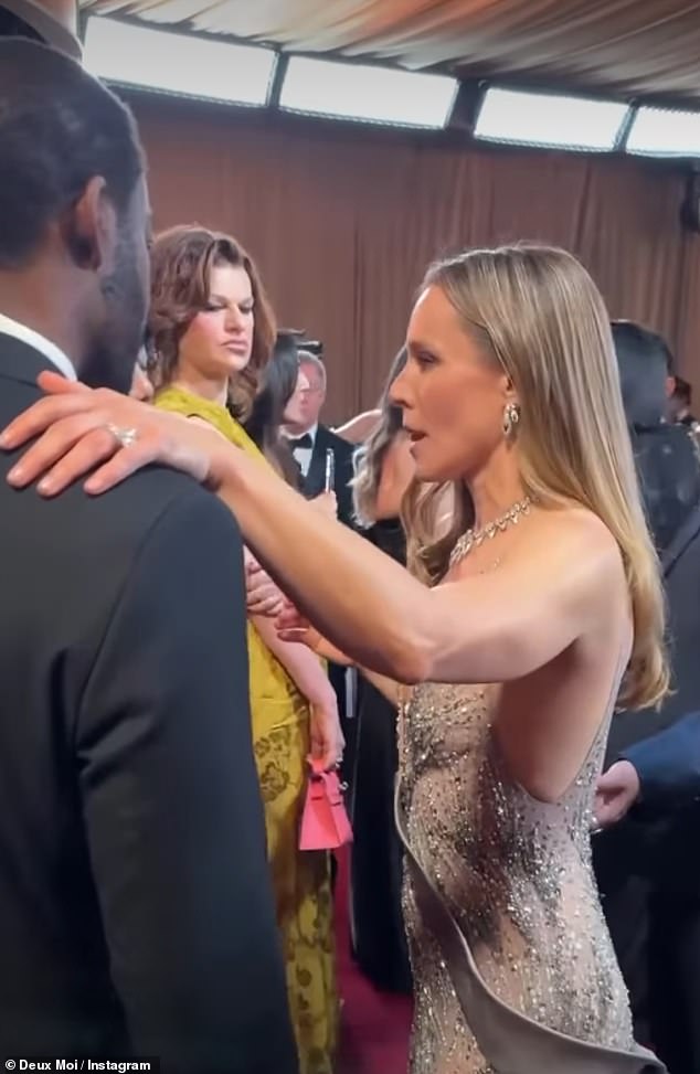 While Bell mingled cheerfully with other guests, Bernhard could be seen some distance away giving her a withering sidelong glare in footage posted by DeuxMoi