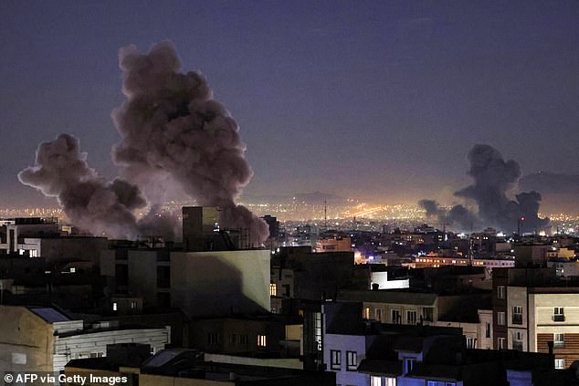 Plumes of smoke rise into the air in Tehran following missile strikes from the US and Israel