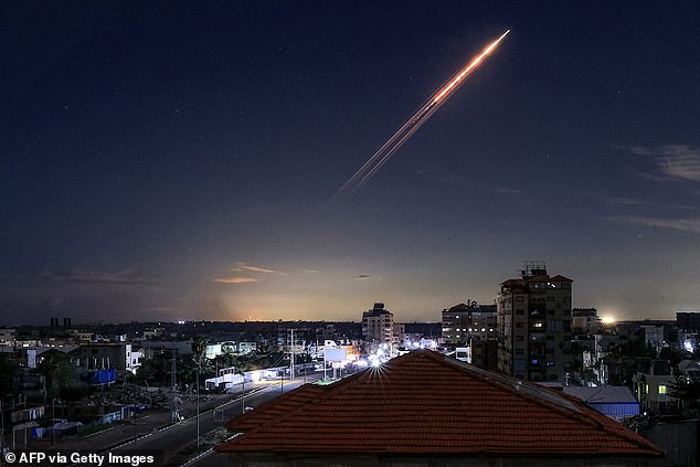 A missile launched from Iran is pictured in the sky from the Bureij camp for Palestinian refugees in the central Gaza Strip