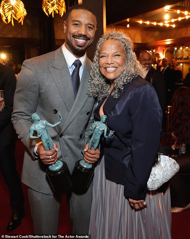 Backstage after accepting his award, Michael, who brought Donna along as his plus one, planted a kiss on his mother's head as he posed for snaps with his award