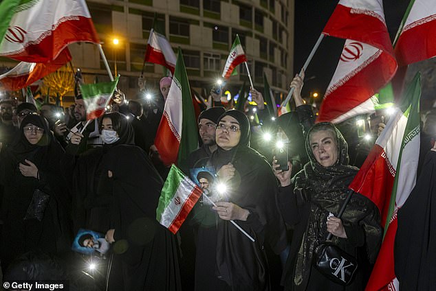 Mourners attend a memorial vigil on Sunday after Iranian state media confirmed the death of Ayatollah Ali Khamenei in Tehran, Iran