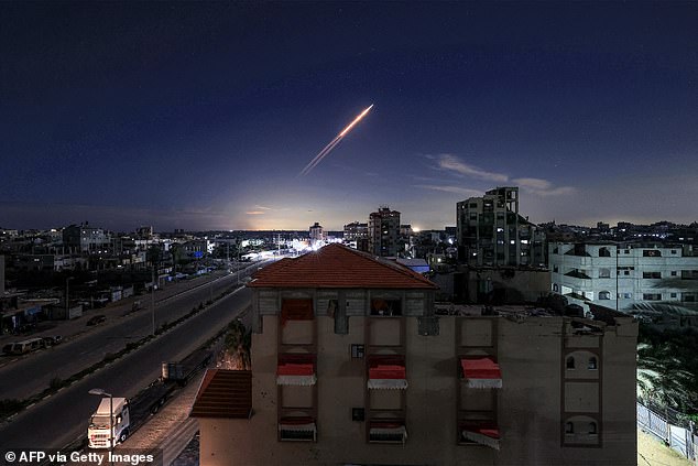 A missile launched from Iran is pictured in the sky from the Bureij camp for Palestinian refugees in the central Gaza Strip