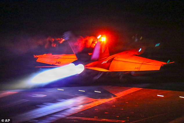 This image provided by U.S. Central Command shows a F/A-18F Super Hornet launching from the USS Abraham Lincoln (CVN 72) in support of Operation Epic Fury, on Sunday