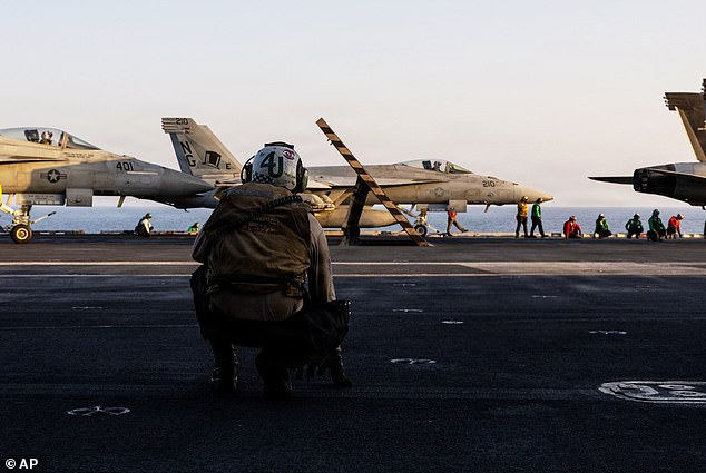 This image provided by U.S. Central Command shows a F/A-18E Super Hornet preparing to take off from the USS Abraham Lincoln (CVN 72) in support of Operation Epic Fury, on Saturday