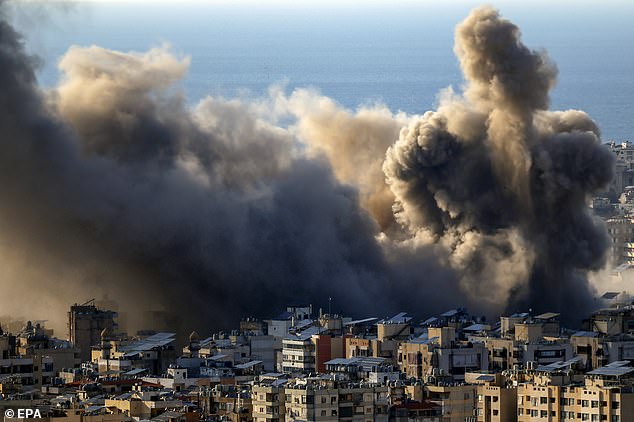 Smoke billows after an Israeli airstrike in Bourj Al Barajneh, in the southern suburbs of Beirut