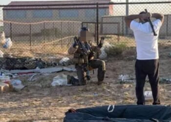 Shocking moment US Top Gun pilot is nearly battered by pipe-wielding local after surviving Kuwait fighter jet crash