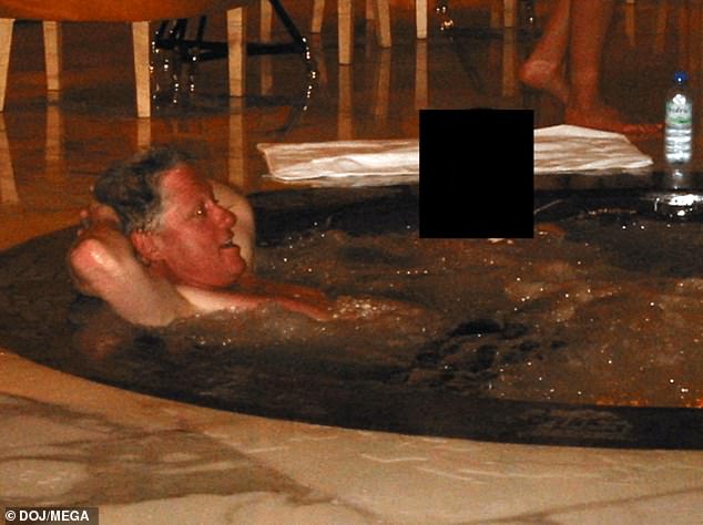 A photograph released in December by the Department of Justice shows Bill Clinton reclining in a hot tub beside a woman whose face was redacted