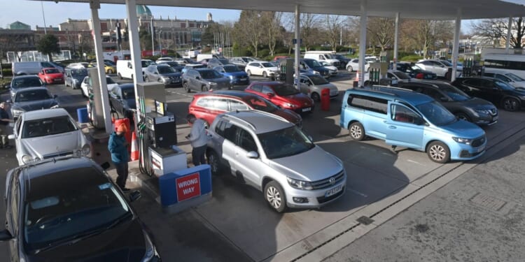 Huge queues at petrol stations as panicked Brits fear fuel prices could rise due to Middle East mayhem