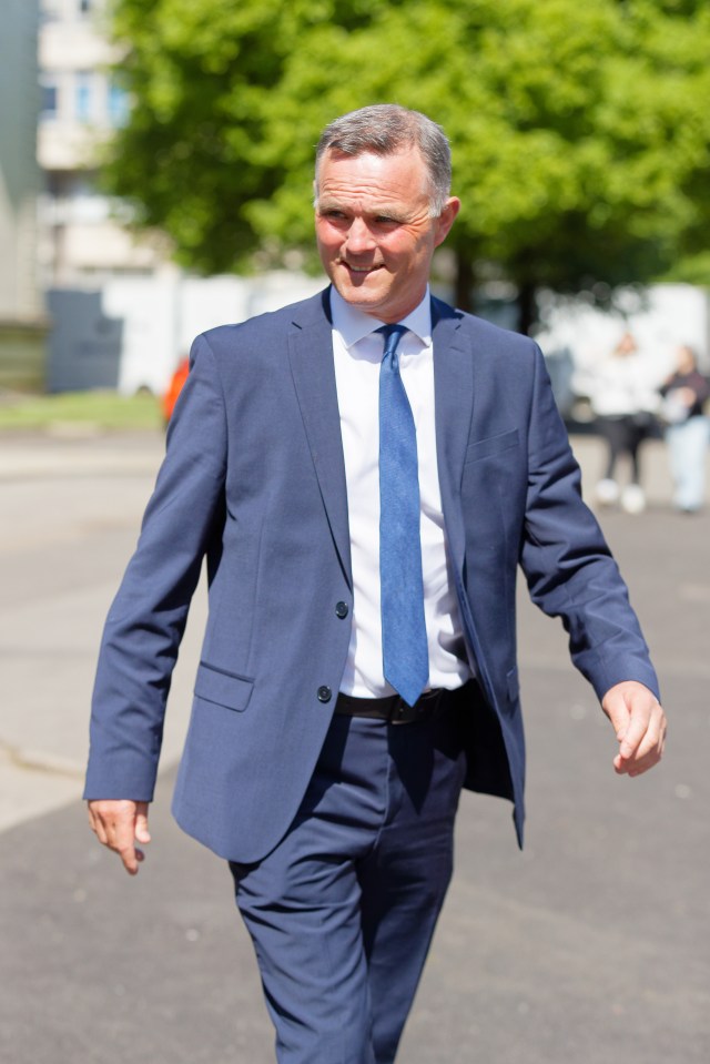 Richard Evan Williams, a Welsh Grand National horse trainer, walks outdoors.