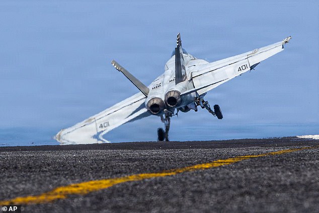 This image provided by U.S. Central Command shows a F/A-18E Super Hornet launching from the USS Abraham Lincoln (CVN 72) in support of Operation Epic Fury on Monday