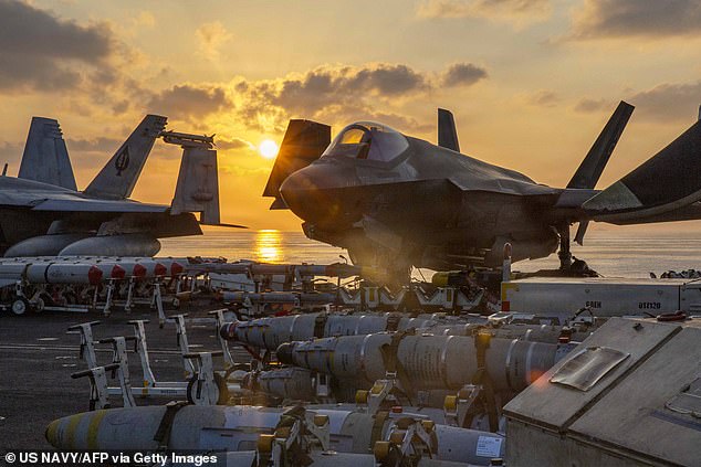 This US Navy handout photo released by US Central Command public affairs shows an F-35C Lightning II, attached to Marine Fighter Attack Squadron (VMFA) 314, being staged for flight operations on the flight deck of Nimitz-class aircraft carrier USS Abraham Lincoln (CVN 72) in support of Operation Epic Fury on March 2