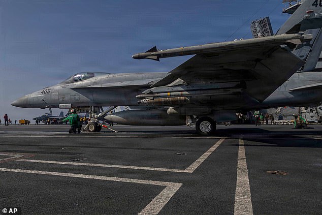 This image provided by U.S. Central Command shows a F/A-18E Super Hornet preparing to launch from the USS Abraham Lincoln (CVN 72) in support of Operation Epic Fury on Monday