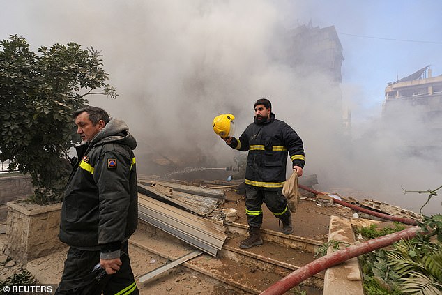 Emergency personnel work at the site of an Israeli strike on Beirut's southern suburbs, following an escalation between Hezbollah and Israel amid the U.S.-Israeli conflict with Iran, Lebanon, March 3