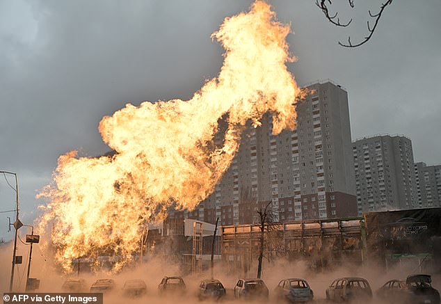 Fire and burnt-out cars seen after a missile strike in Kyiv, Ukraine in January 2024 amid the Russian invasion
