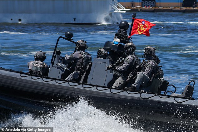 Taiwanese Coast Guard Special Task Unit troops patrol the threatened country's waters aboard a speedboat. President Xi has designs on the territory